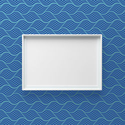 Low angle view of mobile phone against blue background