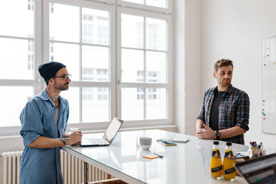 Young men in office