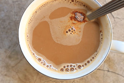 High angle view of coffee in cup on table