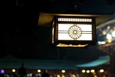 Low angle view of illuminated lights at night