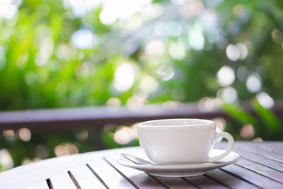Close-up of coffee cup on table