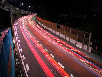 High angle view of light trails on road at night