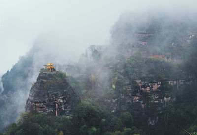 Pavilion on a hill in the mist