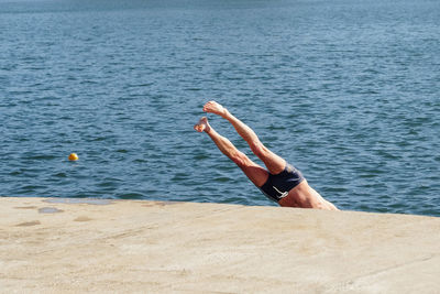 Man jumping into sea 