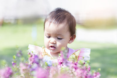 Portrait of cute girl with pink flower