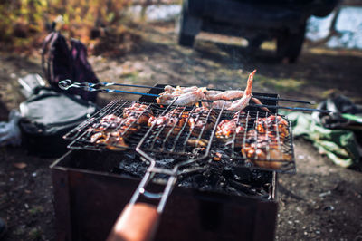 High angle view of meat on barbecue grill