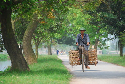 Man standing on footpath in park