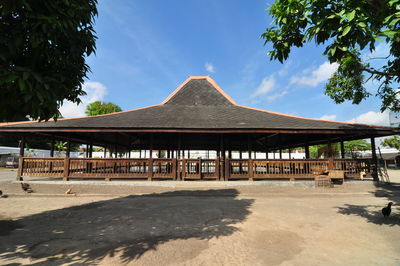 Built structure on beach against sky