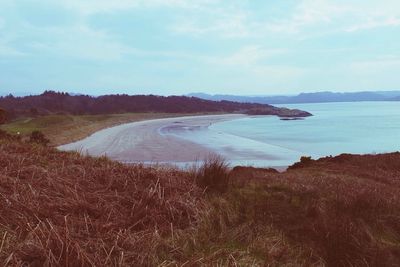 Scenic view of sea against cloudy sky