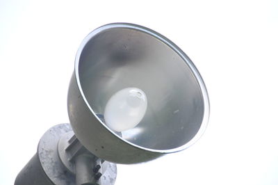 Close-up of person holding cup against white background