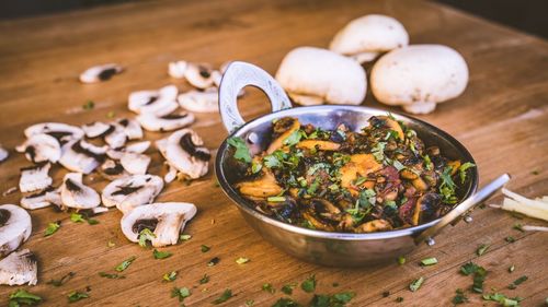 High angle view of mushrooms in bowl on table