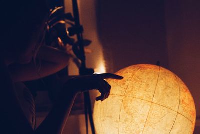 Close-up of person holding table at home