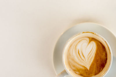 Close-up of cappuccino coffee cup