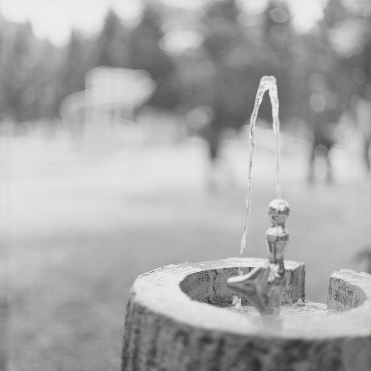 focus on foreground, selective focus, close-up, single object, still life, metal, no people, reflection, table, indoors, lighting equipment, day, absence, metallic, man made object, equipment, bottle, sunlight, focus on background