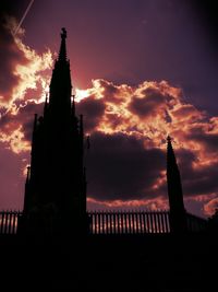 Low angle view of temple against cloudy sky