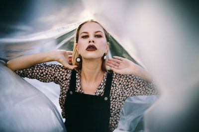 Portrait of young woman in plastic