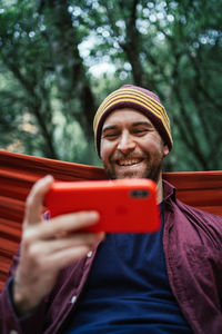 Portrait of young man using mobile phone