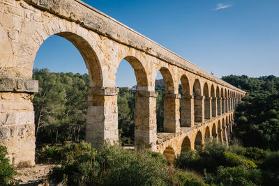 High angle view of aqueduct against blue sky