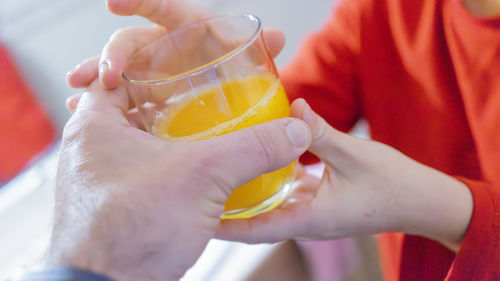 Midsection of woman holding drink