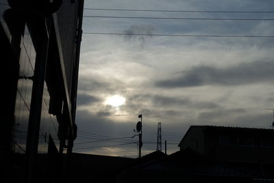 Low angle view of building against cloudy sky