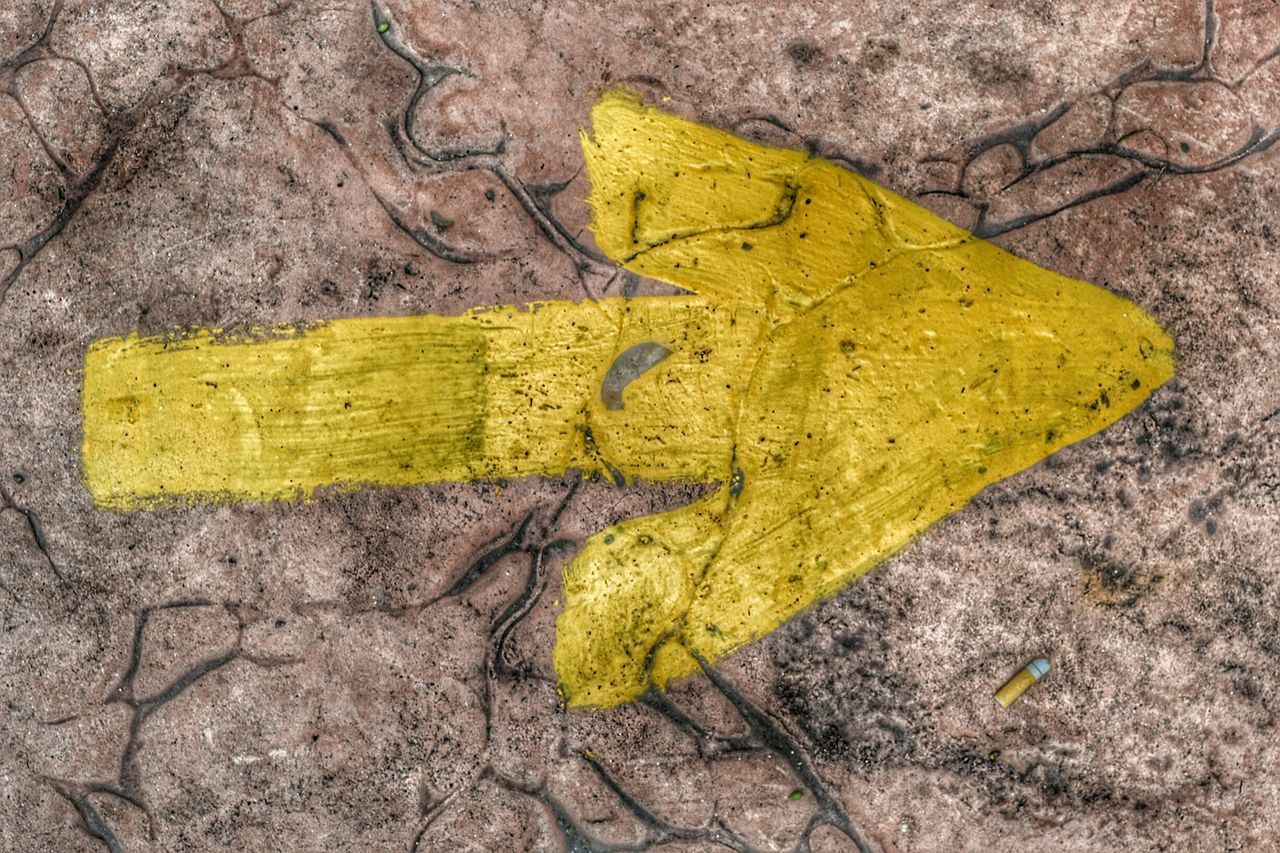 DIRECTLY ABOVE VIEW OF YELLOW LEAF WITH TEXT