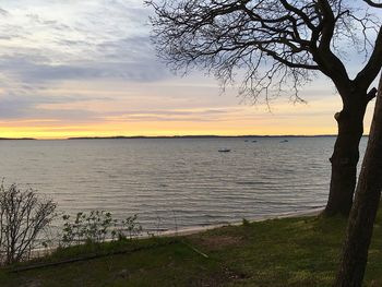 Scenic view of sea against sky at sunset