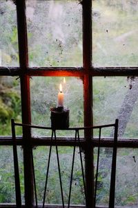 Close-up of fire hydrant on window of building