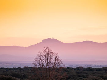 Scenic view of silhouette mountain against sky during sunset