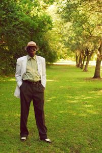 Portrait of man standing on grass