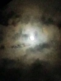 Low angle view of moon against sky at night