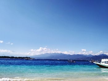 Scenic view of sea against blue sky