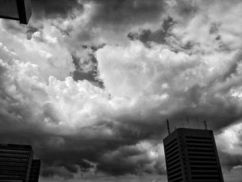 Low angle view of building against cloudy sky