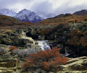 Scenic view of waterfall against sky