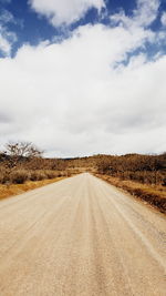 Road amidst landscape against sky