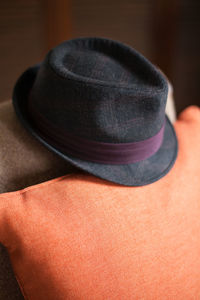 High angle view of hat on cushions at home