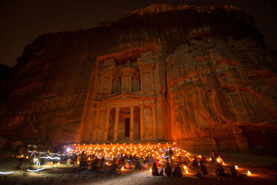 Group of people in temple at night