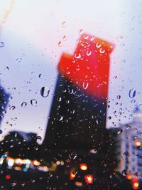 Close-up of wet glass window in rainy season