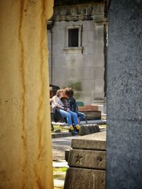 People sitting outside building