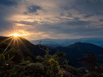 Scenic view of mountains against sky during sunset