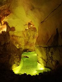 Low angle view of illuminated cave