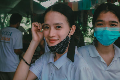 Portrait of young woman wearing mask