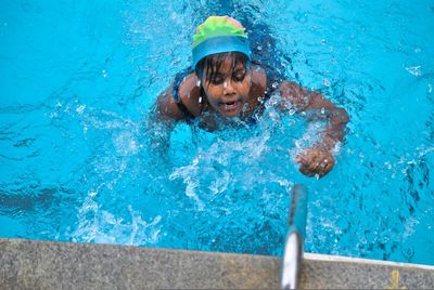 Man swimming in pool