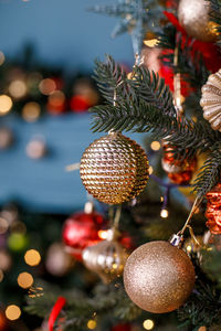 Close-up of christmas decorations hanging on tree