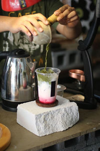 Midsection of woman preparing food on table
