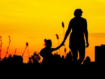 Silhouette of woman at sunset