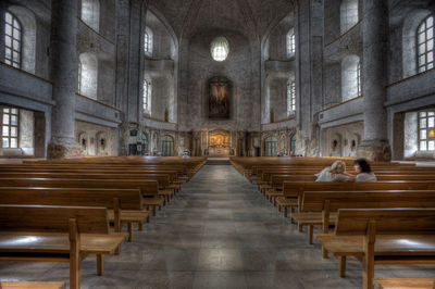 View of empty benches in building