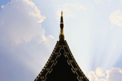 Low angle view of temple against cloudy sky