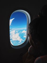 Scenic view of sky seen through airplane window