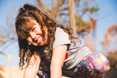 Portrait of cheerful girl outdoors