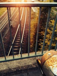 High angle view of coffee on railing